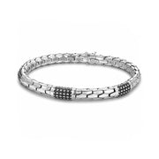 Silver bracelet with black accents on a white background