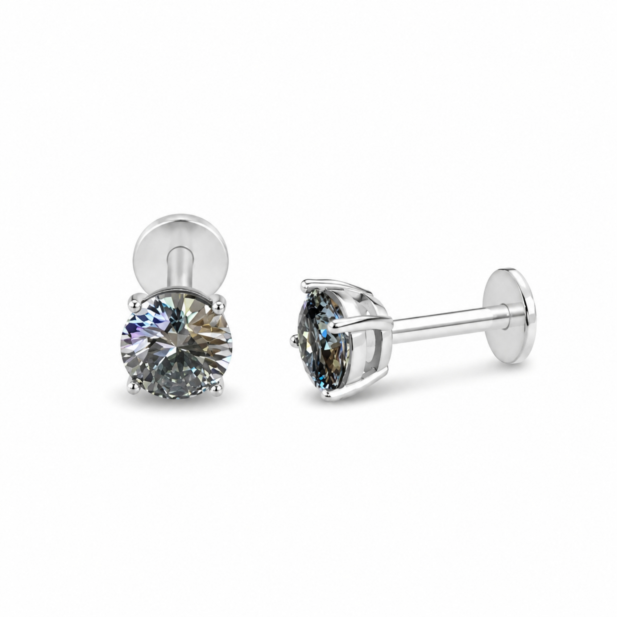 Pair of silver stud earrings with clear gemstones on a white background