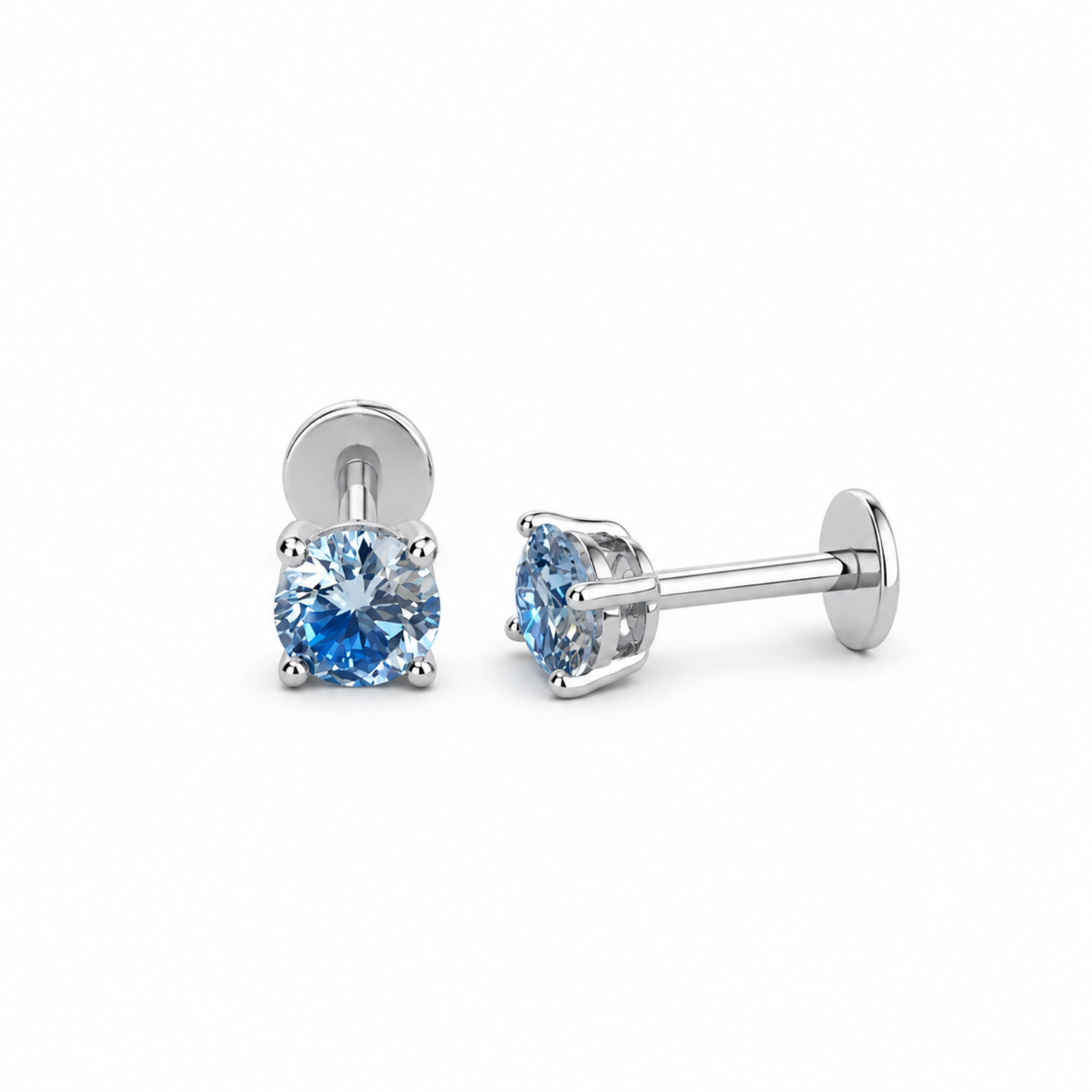 Pair of blue gemstone stud earrings on a white background