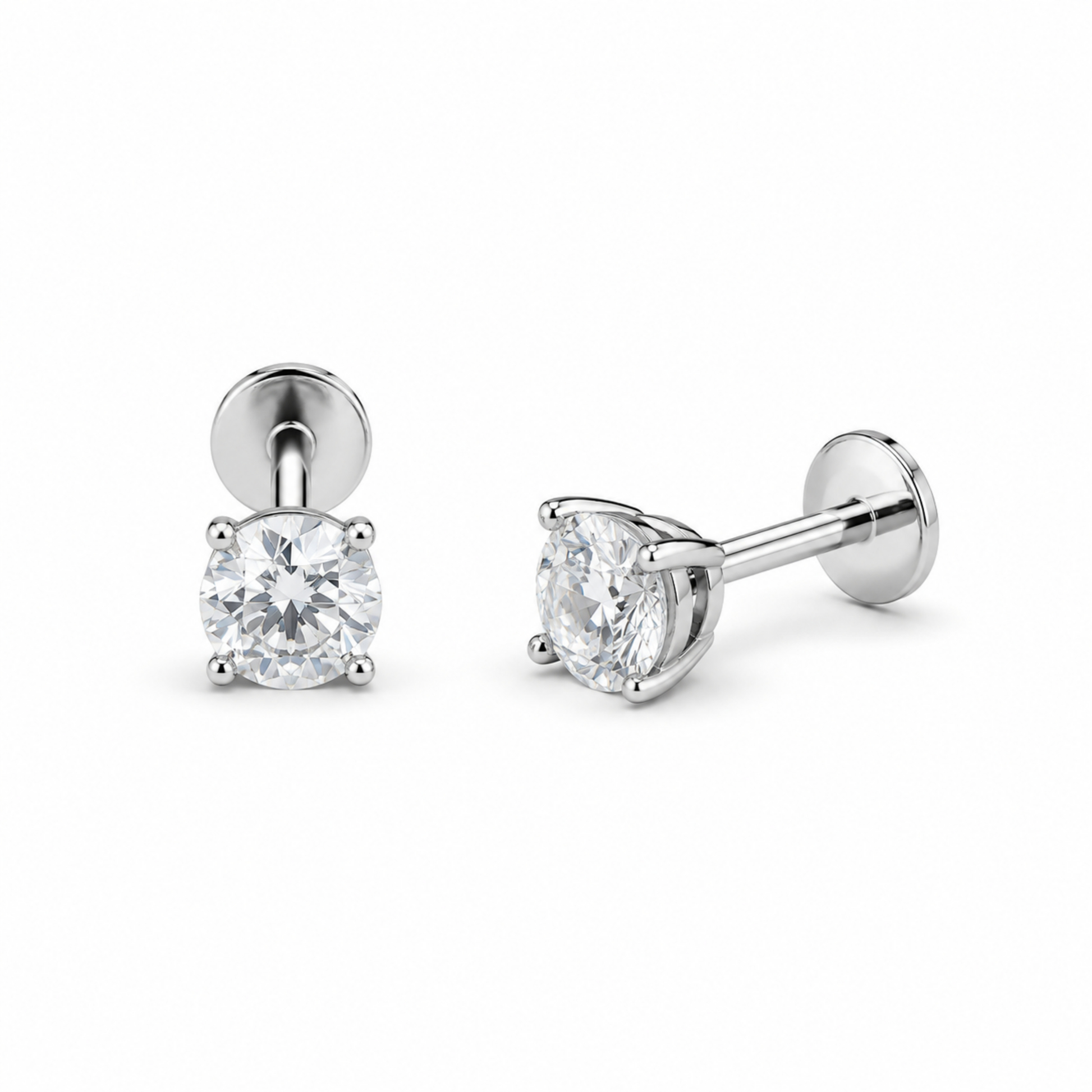 Pair of silver stud earrings with clear gemstones on a white background