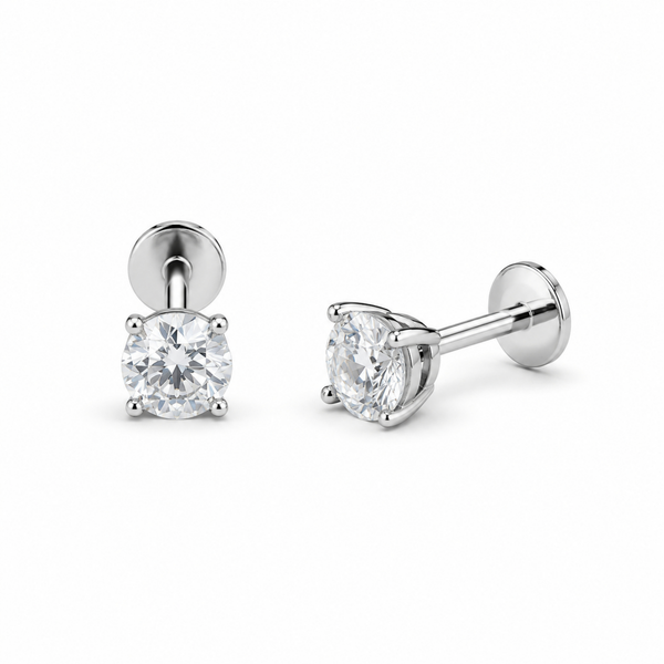 Pair of silver stud earrings with clear gemstones on a white background