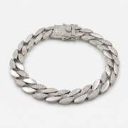Silver chain bracelet with diamond-like stones on a white background