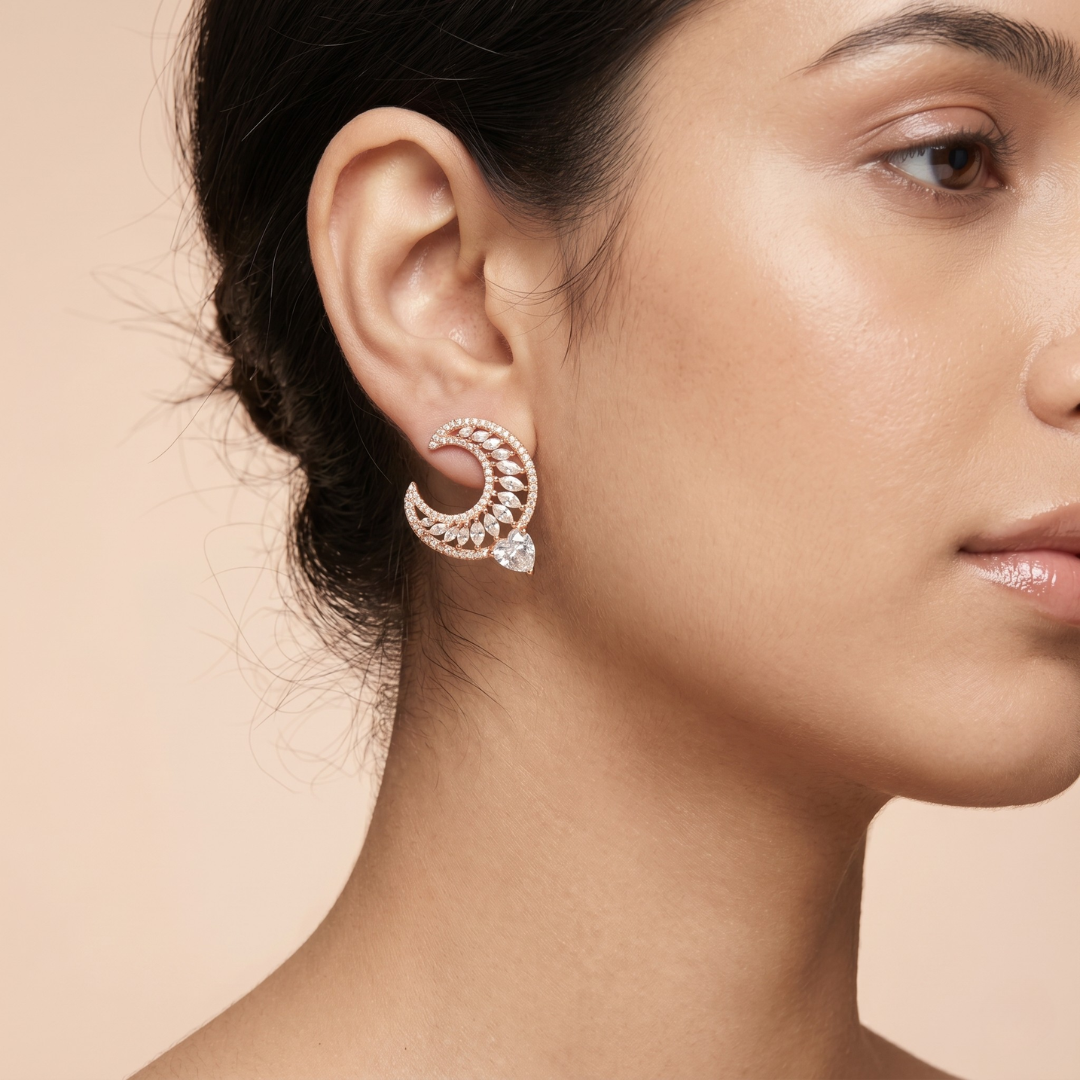 Close-up of a woman wearing a decorative earring on a beige background