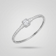Diamond ring with a central gemstone and smaller stones on a light gray background
