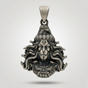 Silver pendant with intricate design on a light gray background