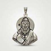 Silver pendant with a detailed design on a white background