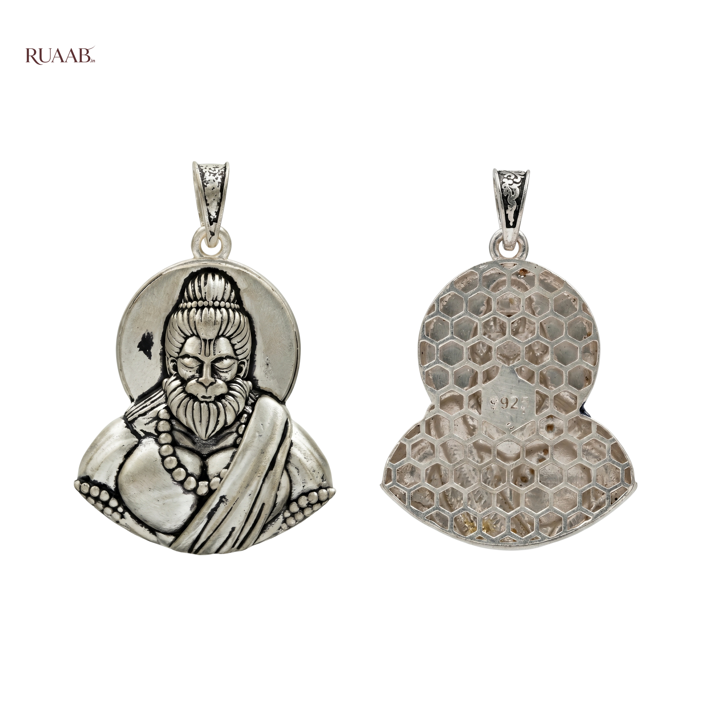 Two silver pendants on a white background, one with a detailed design and the other with a textured surface.